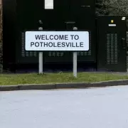 Shefford's 'Banksy' Driver Renames Road 'Potholesville' in Pothole Protest