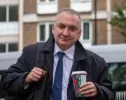 Starmer Faces Criticism Over Cabinet Secretary Ousting Amid Munich Trip