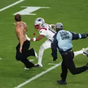 Super Bowl Streaker's 'Trade with Athena' Message Explained After Field Invasion