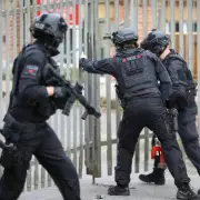 Armed Police Storm Storage Unit in Oldham as Helicopter Circles Overhead