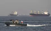 Cargo Ship Attacked in Strait of Hormuz, Crew Evacuates Amid Fire