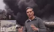 CNN Reporter Broadcasts from Bombed Iranian Oil Depot Amid Toxic Smoke