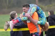 Finnish Duo Triumphs in UK's Eccentric Wife Carrying Race in Dorking