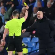 Guardiola's Touchline Ban Sparks Debate as Ex-Referee Weighs In