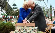King Charles and Queen Camilla Cut Cake with Sword at Eden Project Anniversary