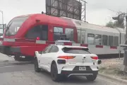 Waymo Driverless Car Stops on Railroad Tracks as Train Passes Inches Away