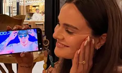 Holly Ramsay Supports Adam Peaty's Championship Win from Portugal