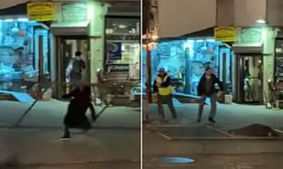 Shocking Video Shows Woman Struck by Falling Fence on NYC Street