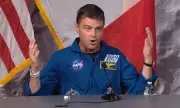Astronaut's Emotional Return: Cross on Navy Chaplain's Collar Brings Tears
