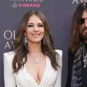 Elizabeth Hurley and Billy Ray Cyrus Dazzle at 50th Olivier Awards Red Carpet