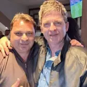 Ex-Premier League Star Kinkladze Stuns Fans with New Look Alongside Oasis Icon