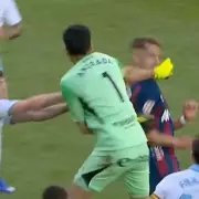 Goalkeeper punches opponent in face after red card, sparking mass brawl