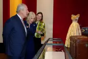 King Charles Amused by Late Queen's Quirky Outfits at Buckingham Palace Exhibition