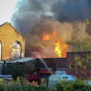Major Fire Engulfs Derelict Radcliffe Building, Prompting Large Emergency Response