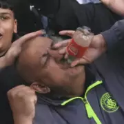 Man City Fans Taunt Arsenal with Viral Bottle Gesture at Chelsea Clash