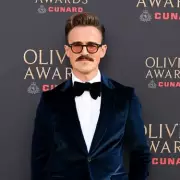 Tom Fletcher Debuts Suave New Look at Olivier Awards as Paddington Musical Triumphs