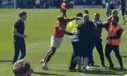 York City Player Appears to Strike Rochdale Fan During Pitch Invasion