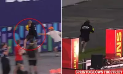 Young AFL fan steals match ball and sprints out of stadium
