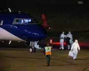 Australians from Hantavirus Cruise Ship Fly Home in Full PPE