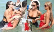 Brooks Nader Dips in Ocean During Miami Swim Week in Red Dress