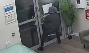 Bungling burglar caught on CCTV struggling with locked doors after theft
