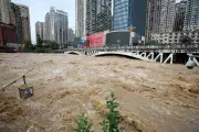 China Floods: 24 Dead, Rescue Workers Swim to Reach Trapped Residents