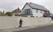 Dorset homeowner wins 'Berlin Wall' battle to keep concrete fence