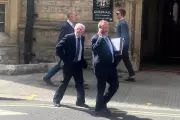 Father and son face £20,000 bill over neighbour's laundry dispute