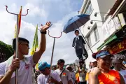 Global Weekend Photos: Protests, Parades, and Erupting Geyser