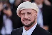 John Travolta Explains His Cannes Beret Look as Homage to Directors