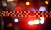 Man Set Alight in Warrawong Apartment Block, Police Hunt Suspect