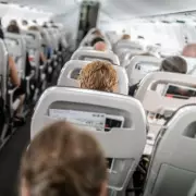Passenger's Kind Gesture to Plus-Size Woman on Plane Sparks Debate