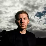 Professor Green Reveals Four Tumours: One Behind Eye, Three on Spine