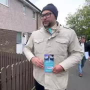Reform activist suspended over N-word claims seen campaigning in Burnham seat