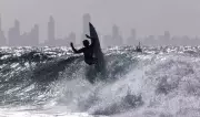 Surfing Contest and Cheese Race Highlight Monday's Photos