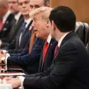 Trump's Beijing Visit: From Strongman to Doorman in a 15-Second Handshake