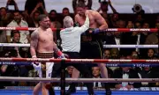 Usyk Survives Scare, Stops Verhoeven in 11th to Retain Title