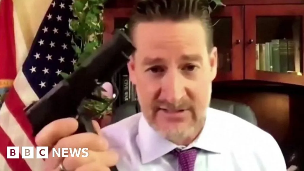 Republican Congressman Displays Handguns During Gun Law Debate
