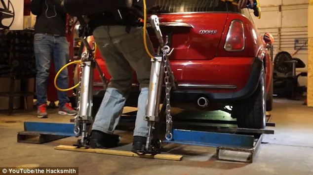 Canadian inventor lifts car with homemade Iron Man-style exoskeleton