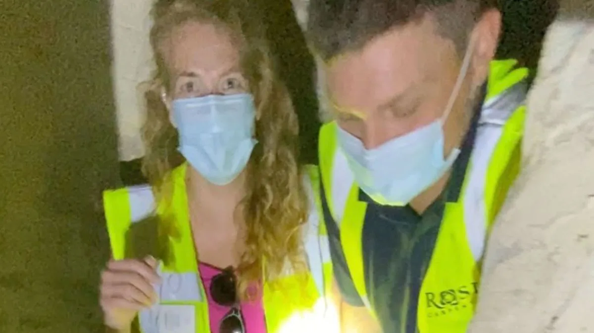 Couple discover hidden room with iron bed behind wall of new home