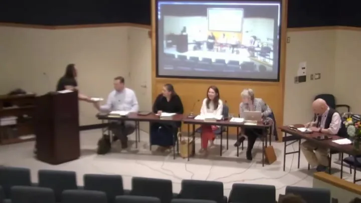 Activist hands 'laxative-laced brownies' to school board in PFAS protest