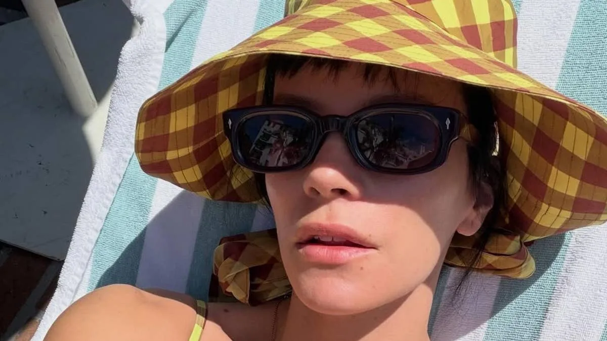 Lily Allen Relaxes Poolside in Yellow Swimsuit Reading Lena Dunham's Book
