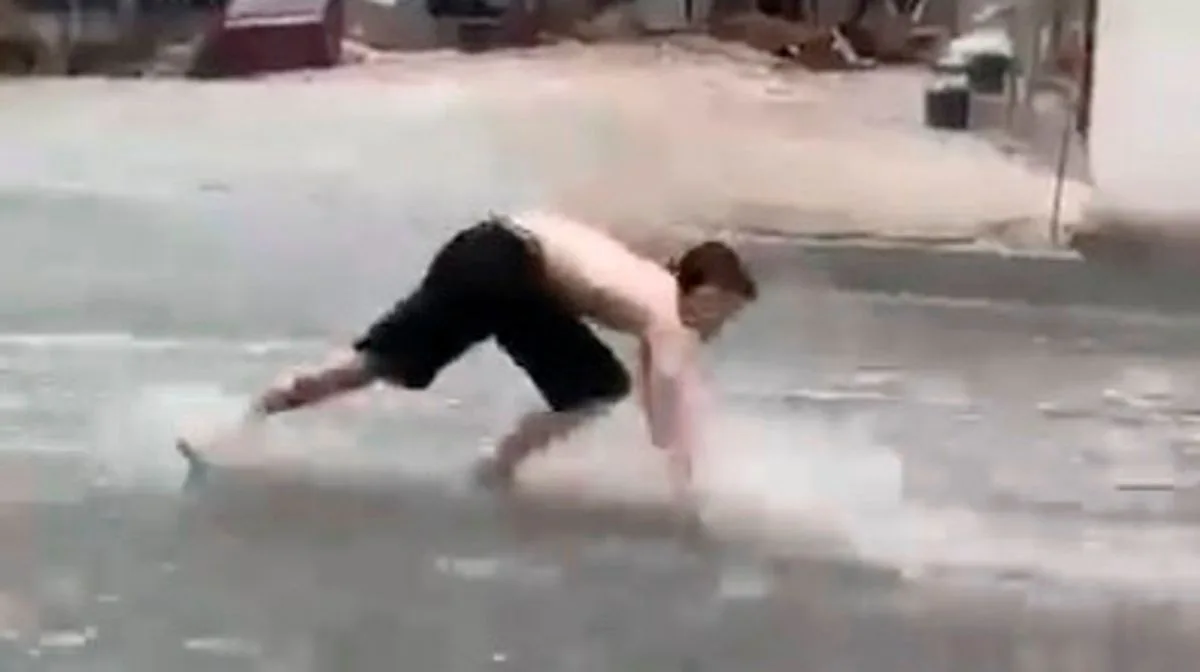 Man Pretends to Swim Through Flooded Benidorm Streets as Freak Storm Hits