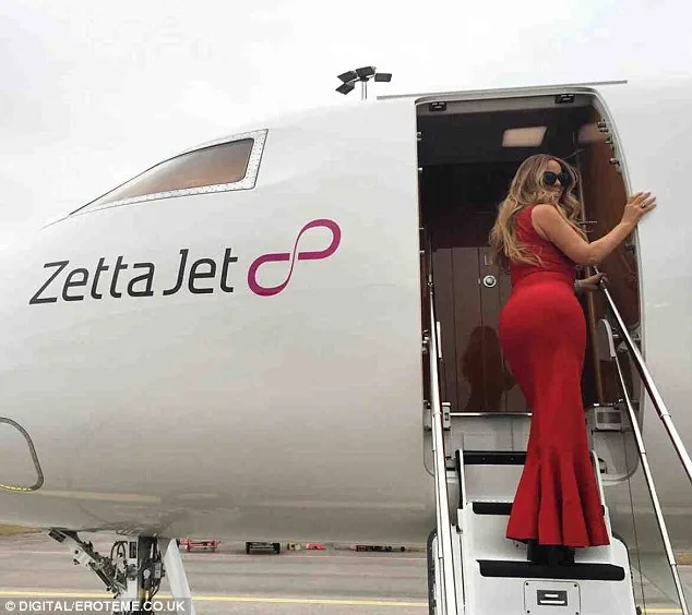 Mariah Carey dazzles in red gown as she jets off to Helsinki for Sweet Sweet Fantasy tour