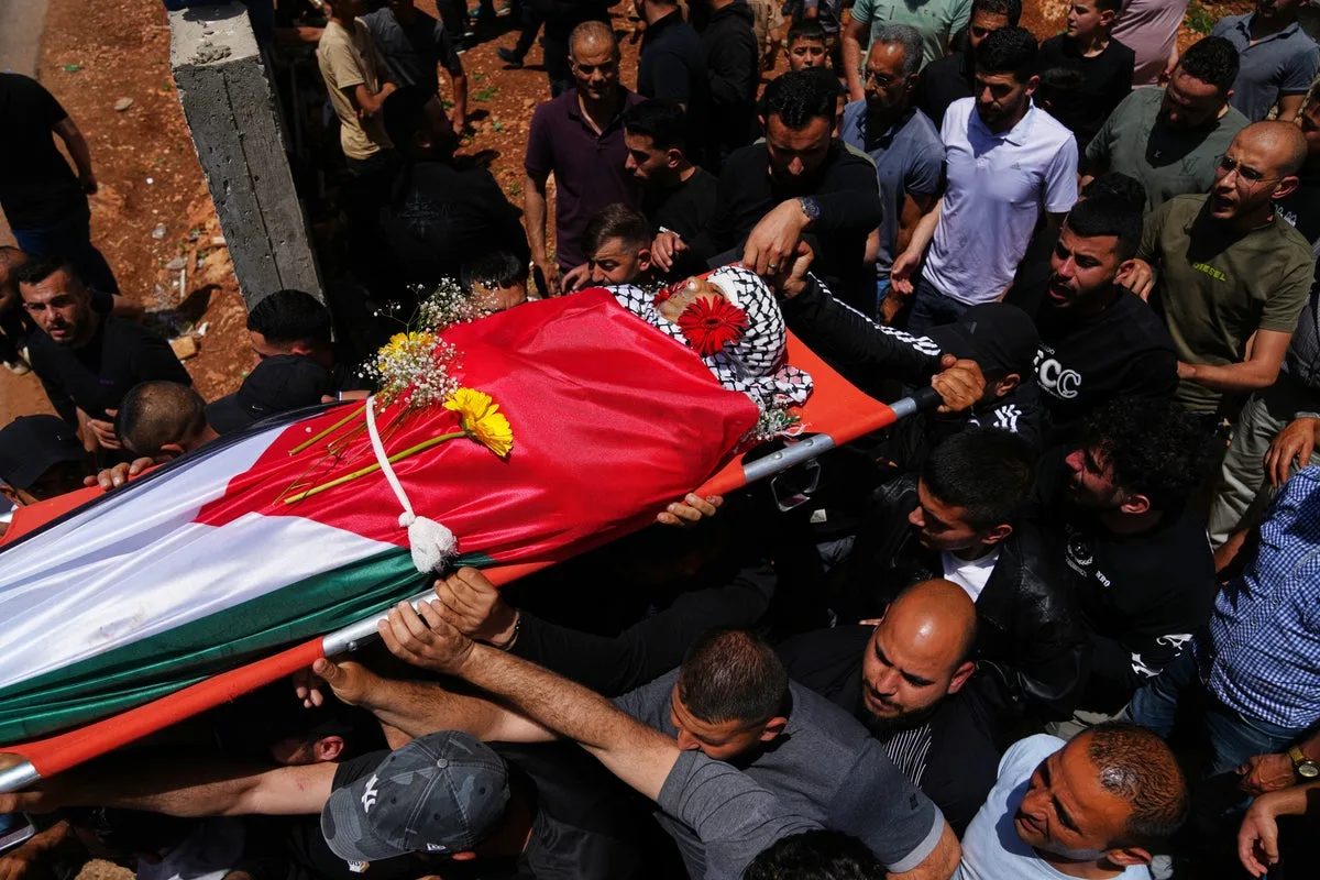 Palestinian Shot Dead Climbing West Bank Barrier For Work