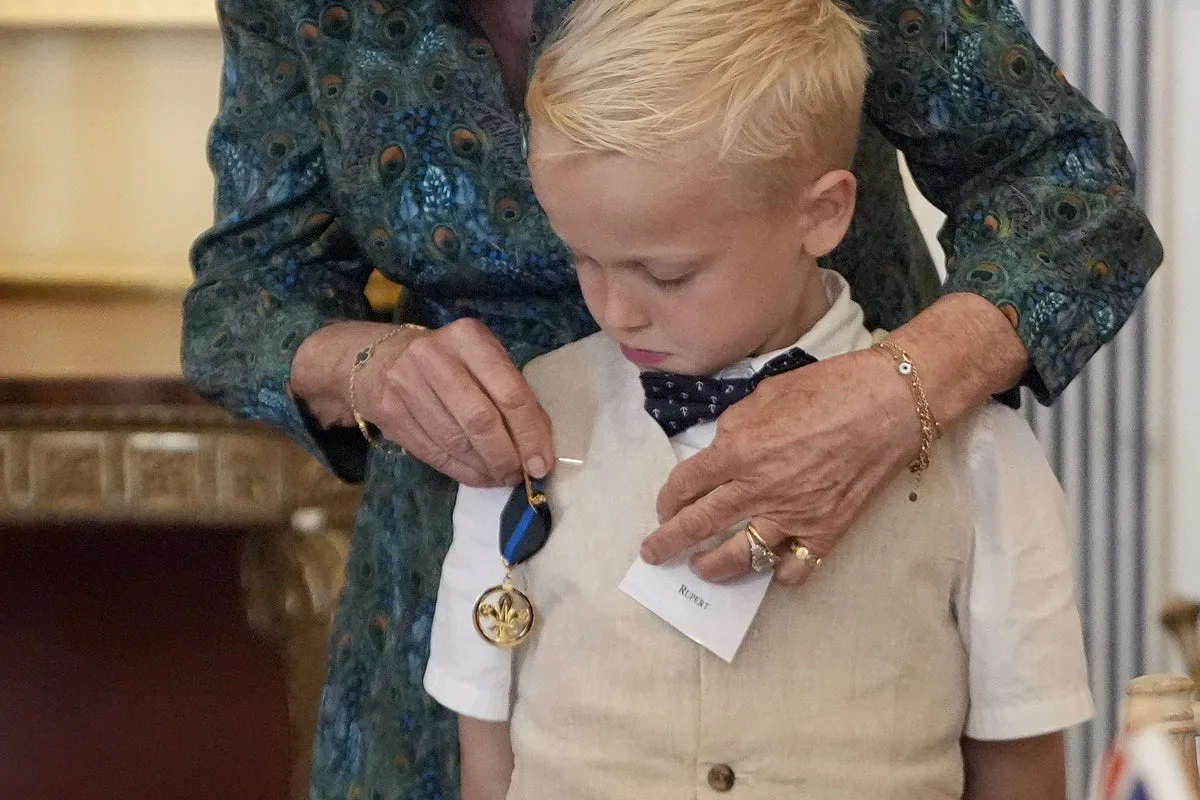 Queen Camilla Pins Bravery Medal on Ill Boy at Tea Party