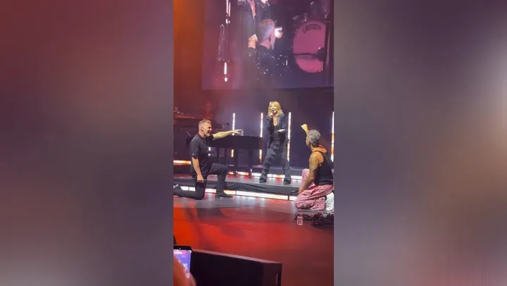 Robbie Williams and Gary Barlow Reunite On Stage For First Time In Nearly A Decade