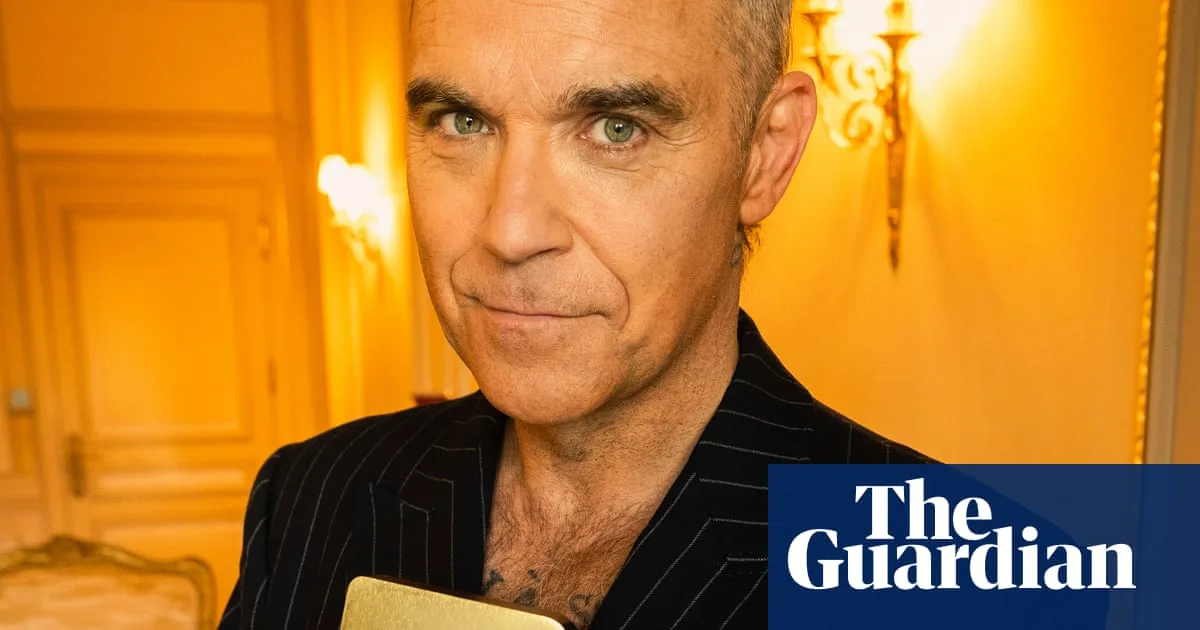 Robbie Williams Breaks Beatles' UK Album Record with 16th Number One