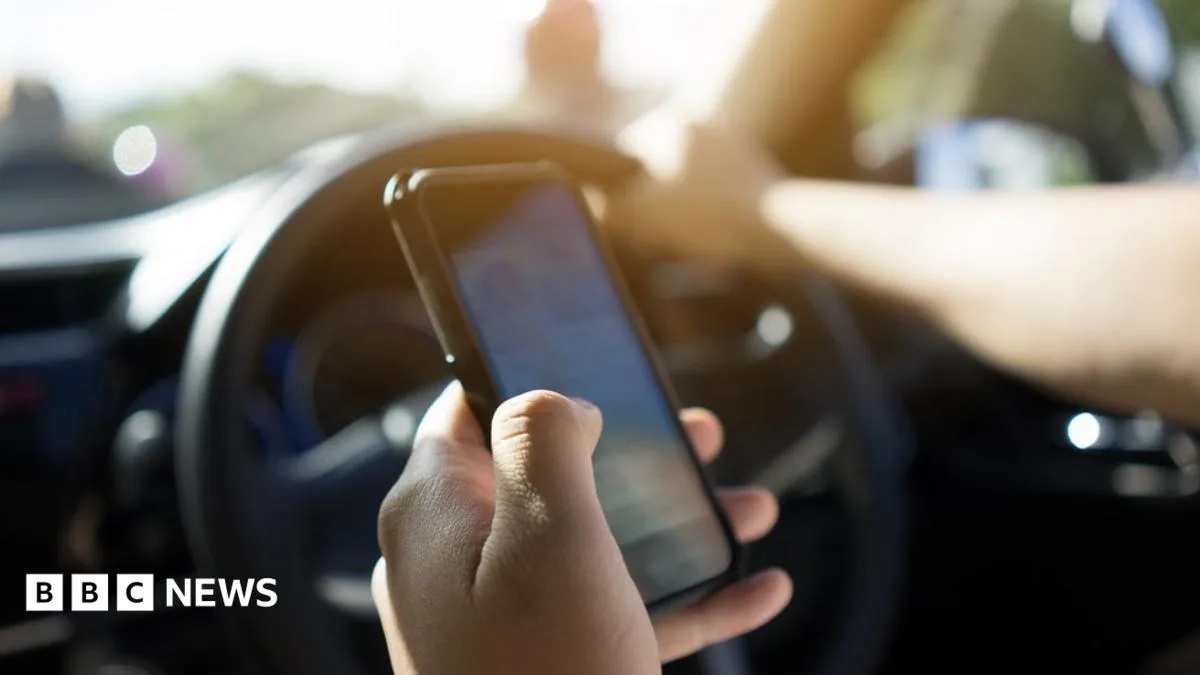 UK to Ban Drivers from Using Hand-Held Devices for Photos and Games