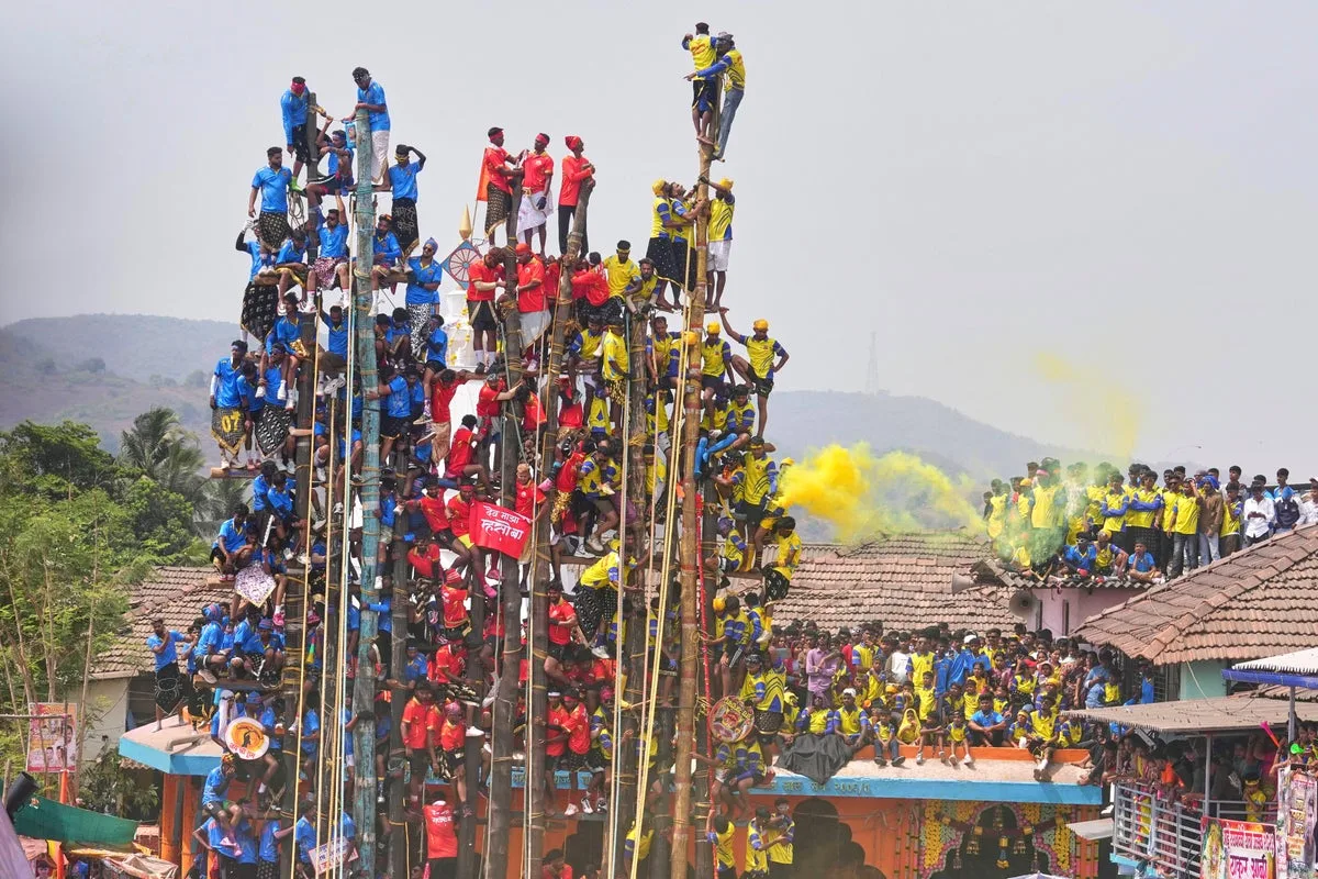 Villagers Compete to Erect Giant Bamboo Poles at Indian Festival